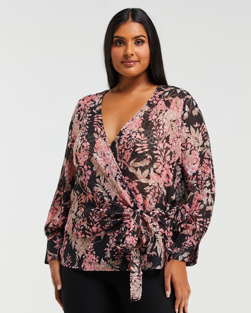 Front of a model wearing a size 1X Harlequin Blooms Top in Print by Estelle. | dia_product_style_image_id:235121